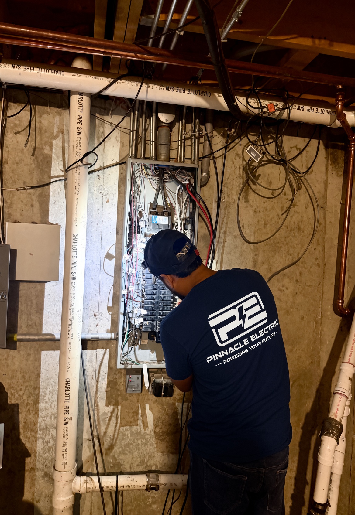 Pinnacle electrician working in a panel